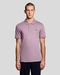 Man wears Everyday Cotton Polo Shirt in Pink Light