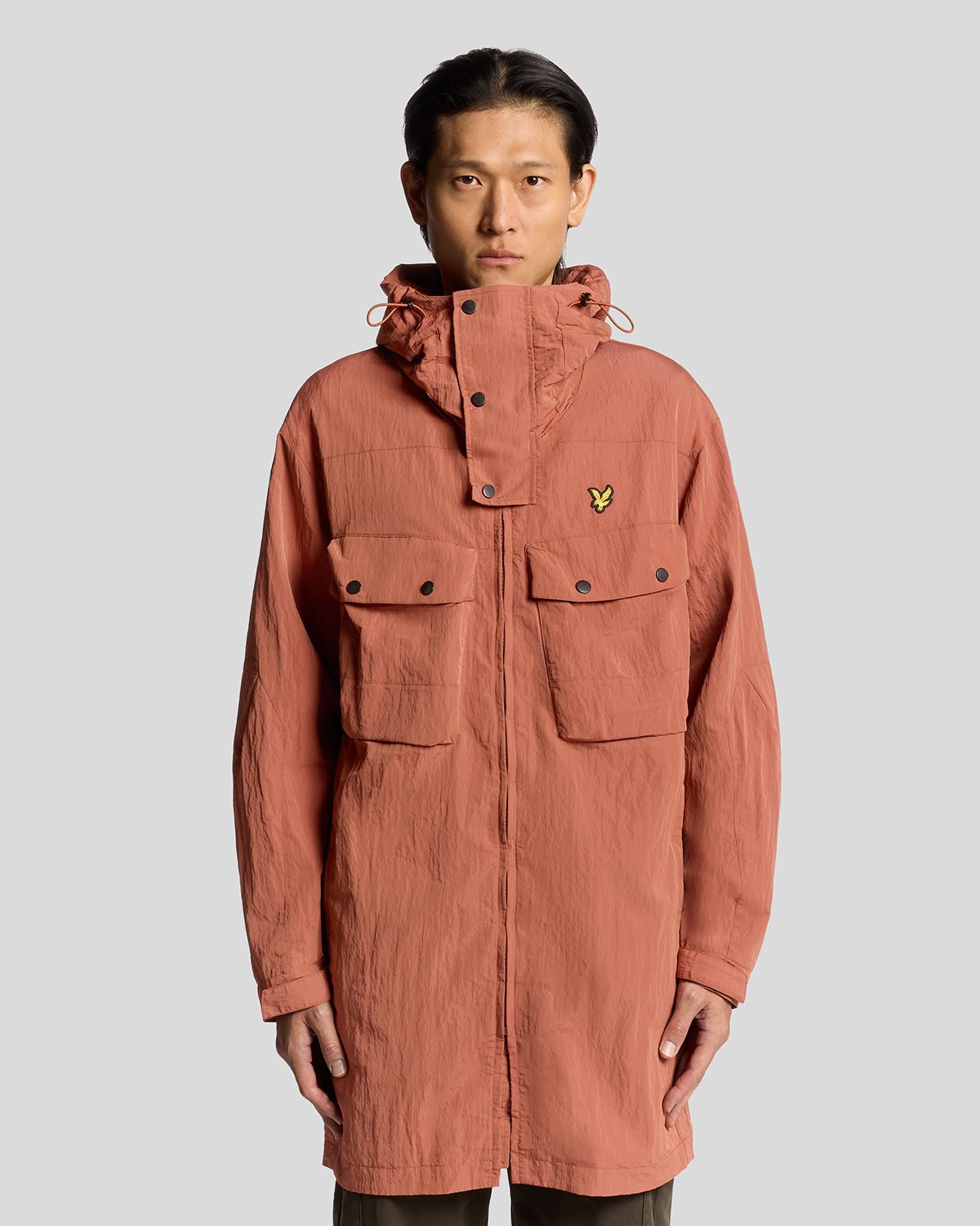 Man wears Water Resistant Guard Parka in Brick