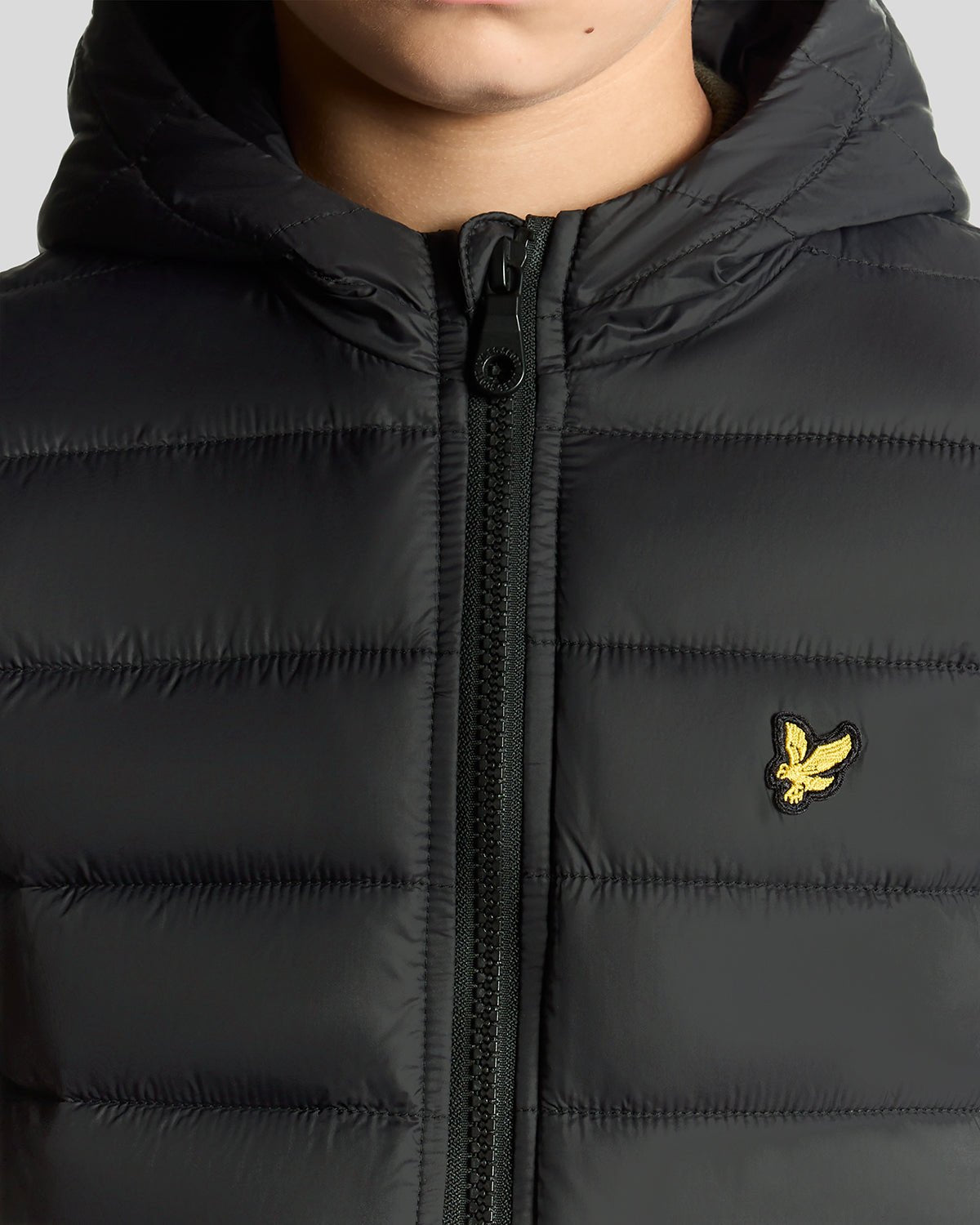Boy wears Lightweight Padded Jacket in Jet Black