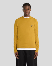 Man wears Cotton Merino Crew Neck Jumper in Bronze