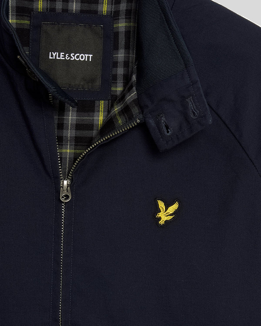 Man wears Cotton Harrington Jacket in Dark Navy