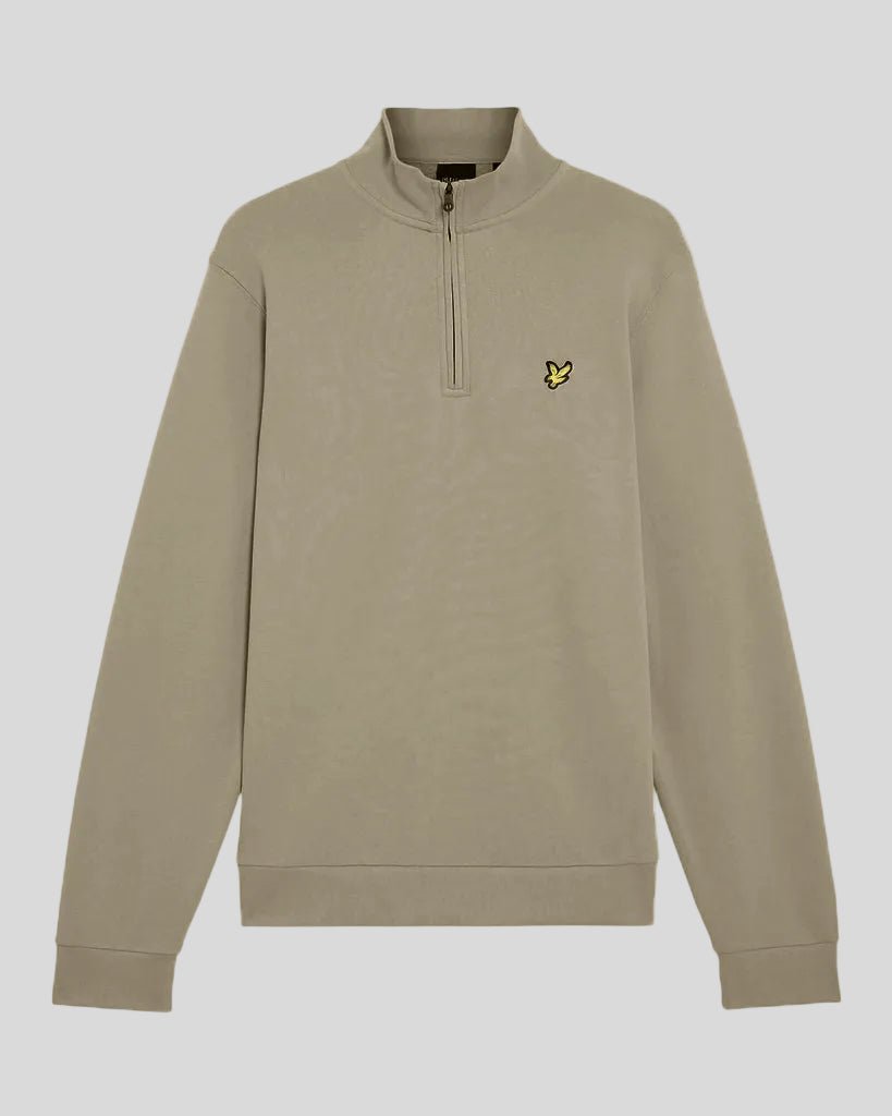 Man wears Everyday 1/4 Zip Cotton Sweatshirt in Woolwich