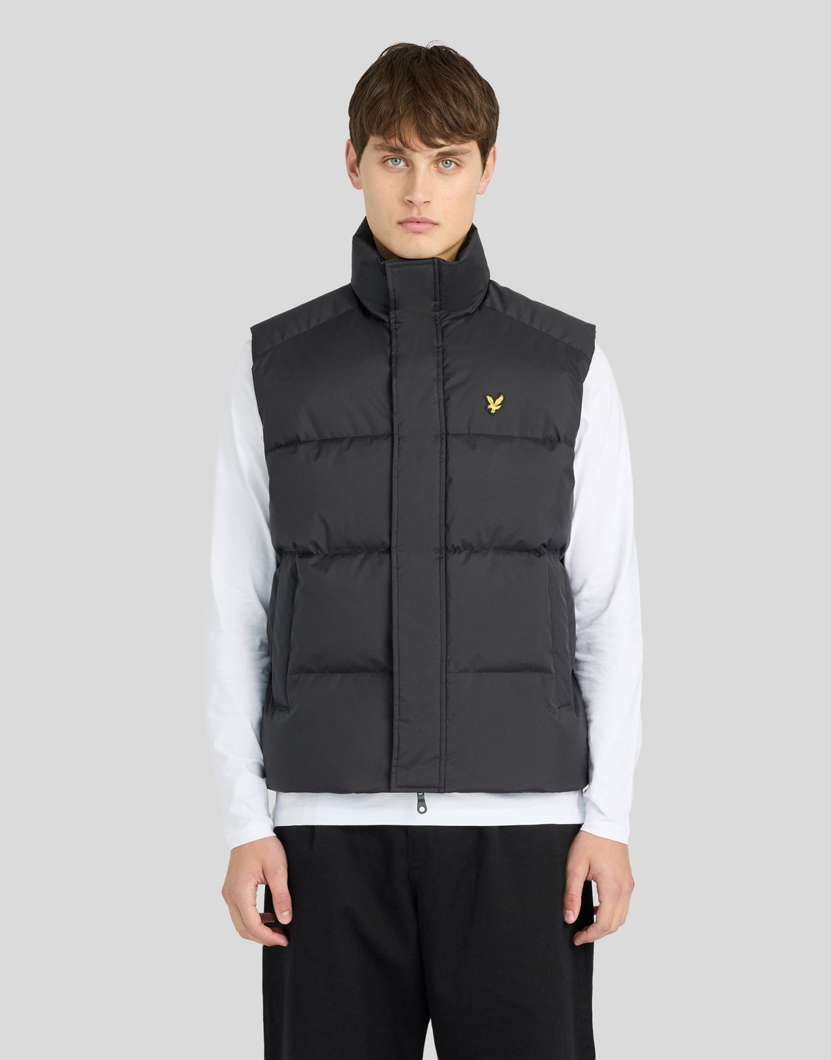 Man wears Funnel Neck Puffer Gilet in Jet Black