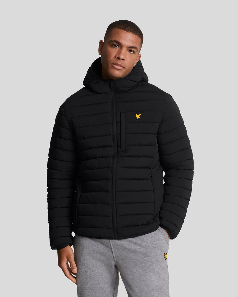Man wears Sports Water Resistant Puffer Jacket in Jet Black