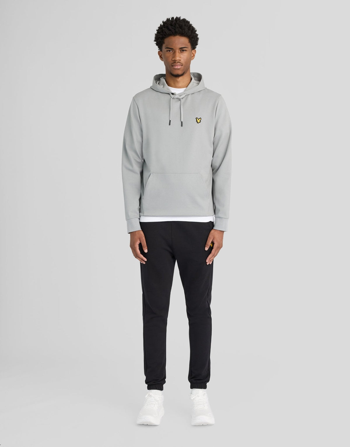 Man wears Sports Lightweight Hoodie in Ultimate Grey