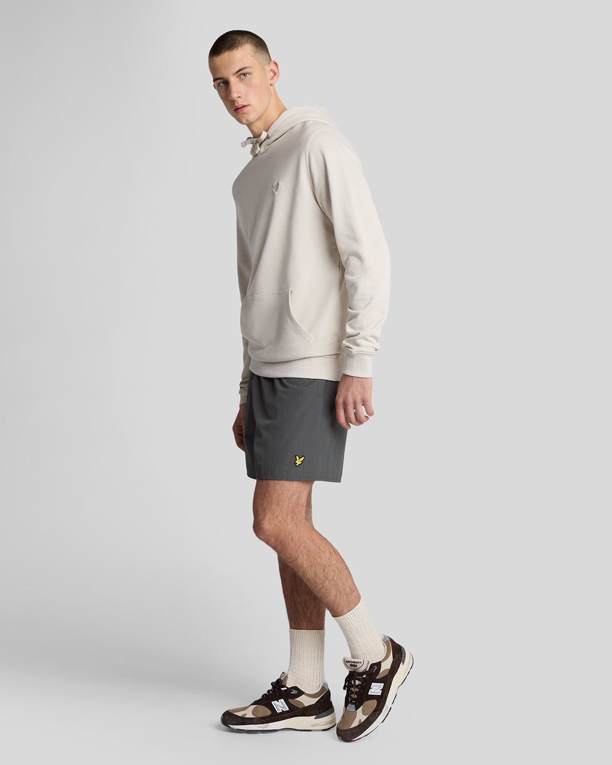 Man wears Plain Swim Shorts in Gunmetal