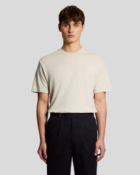 Man wears Relaxed Fit T-Shirt in Birch