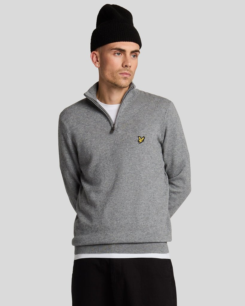 Man wears Cotton Merino 1/4 Zip Jumper in Mid Grey Marl