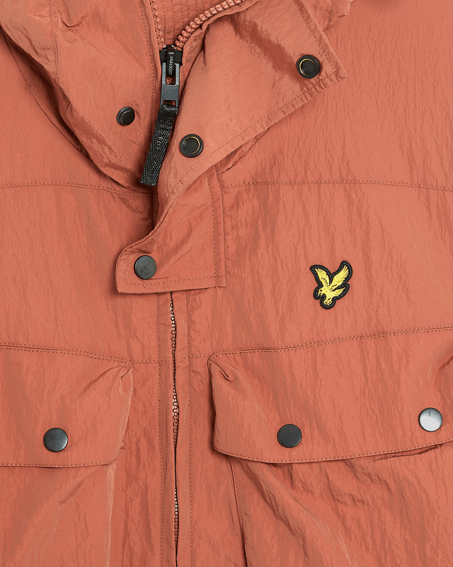 Man wears Water Resistant Guard Parka in Brick