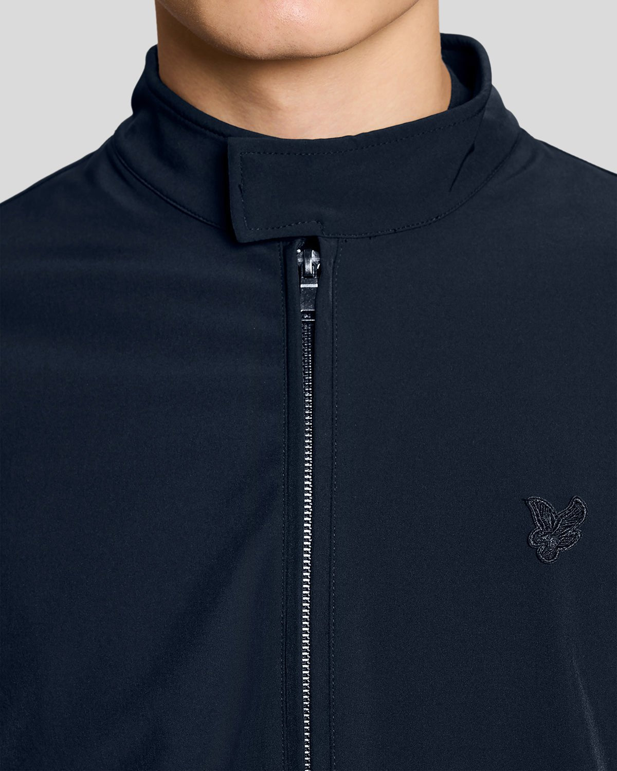 Man wears Lightweight Softshell Jacket in Carbon