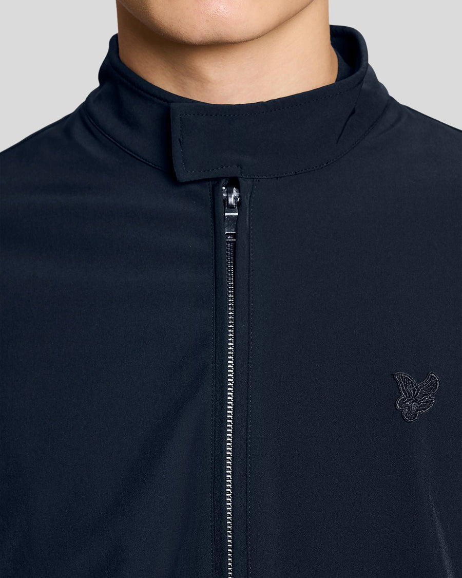 Man wears Lightweight Softshell Jacket in Carbon