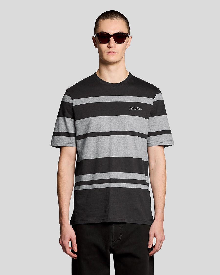 Man wears Relaxed Fit Stripe T-Shirt in Charcoal Grey/ Light Grey Marl