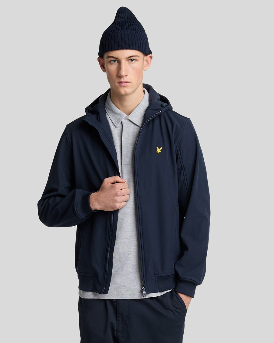 Man wears Fleece Lined Softshell Jacket in Dark Navy