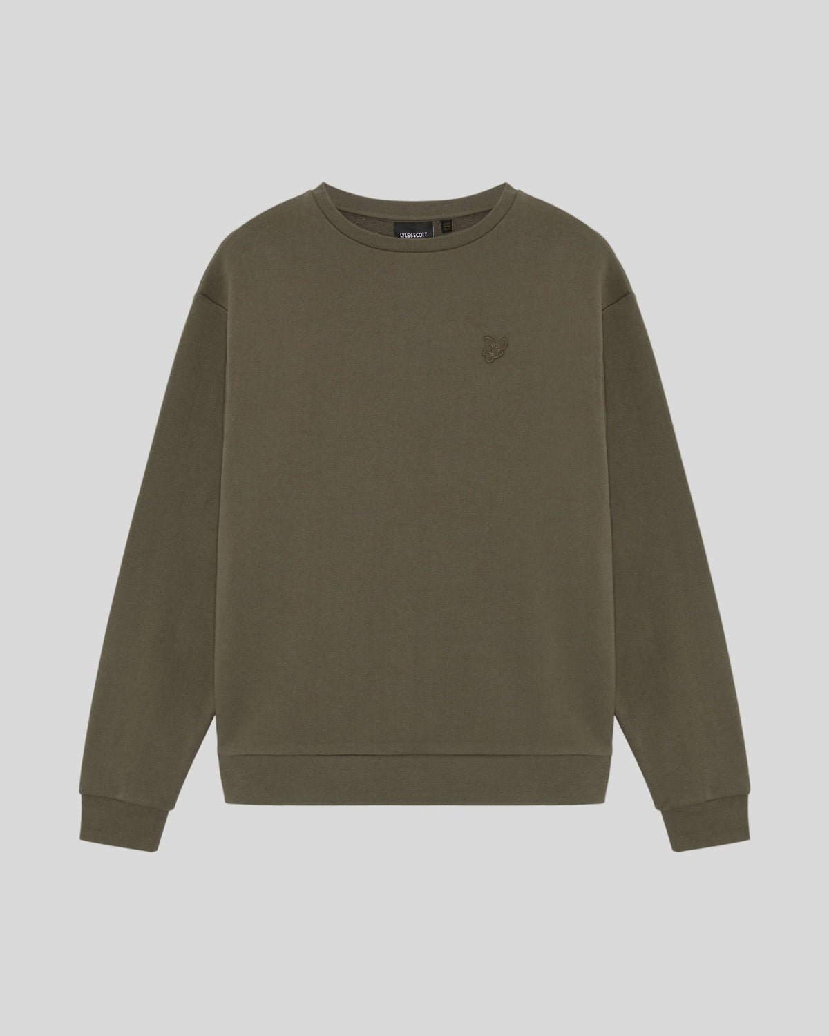 Un homme porte un sweat-shirt en coton épais de couleur kaki cendré