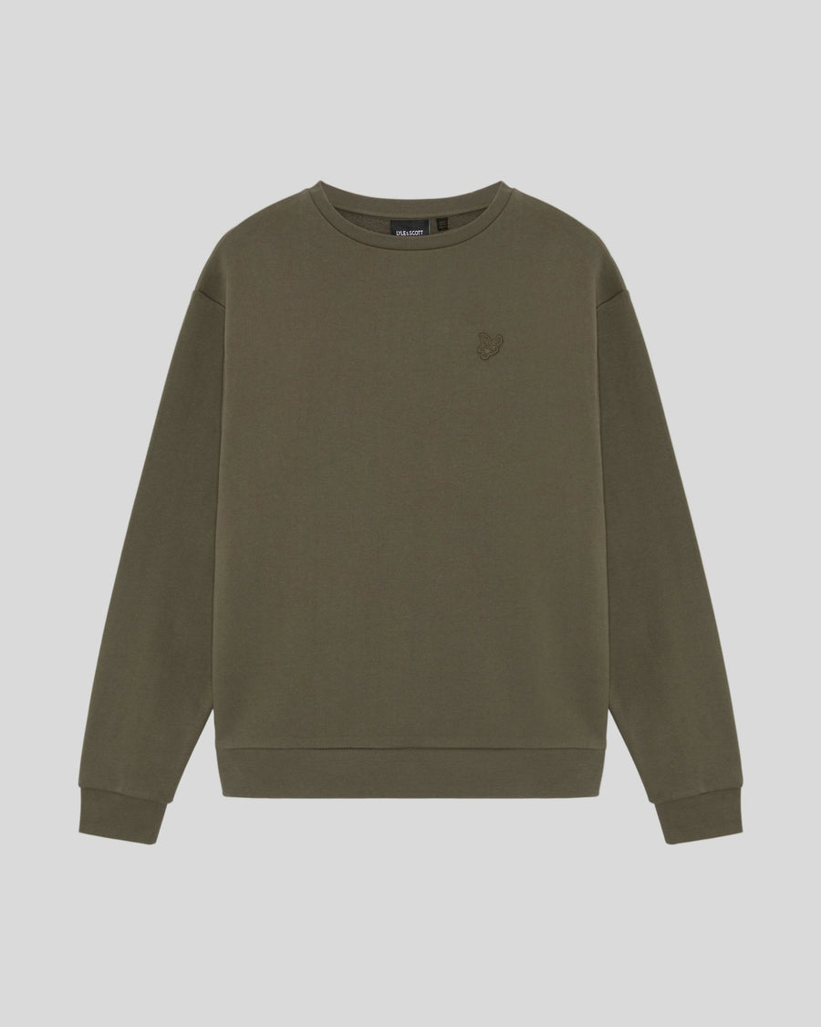 Un homme porte un sweat-shirt en coton épais de couleur kaki cendré