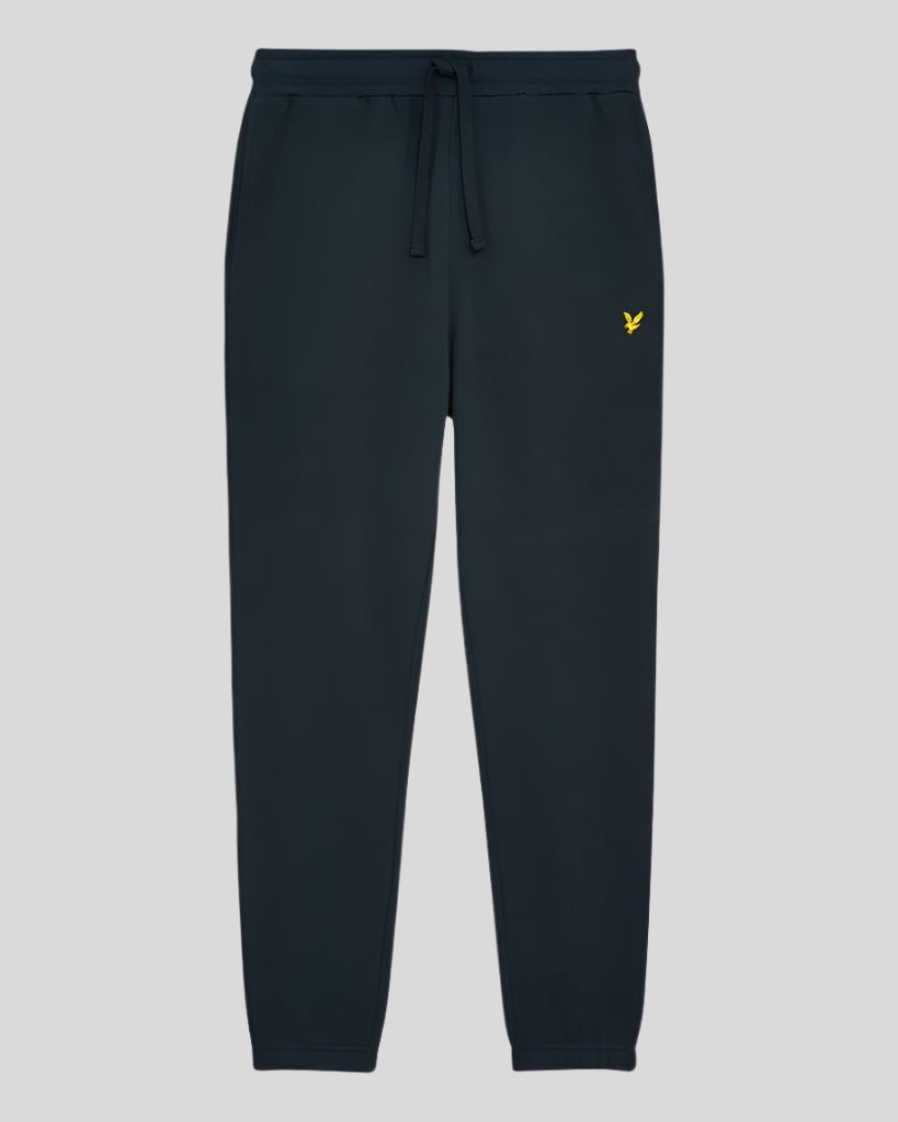 Un homme porte un pantalon de jogging slim en coton bleu marine foncé