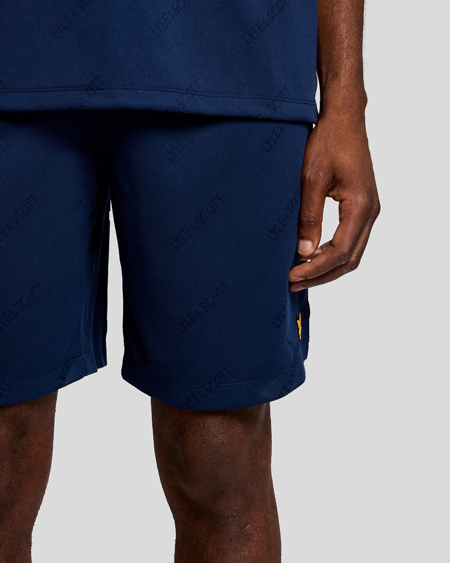 Pantalones cortos de fútbol con el logotipo en relieve, en color azul marino y rosa peonía