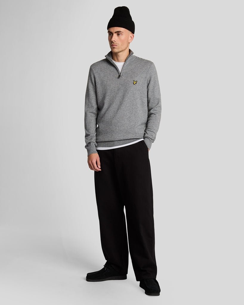 Man wears Cotton Merino 1/4 Zip Jumper in Mid Grey Marl