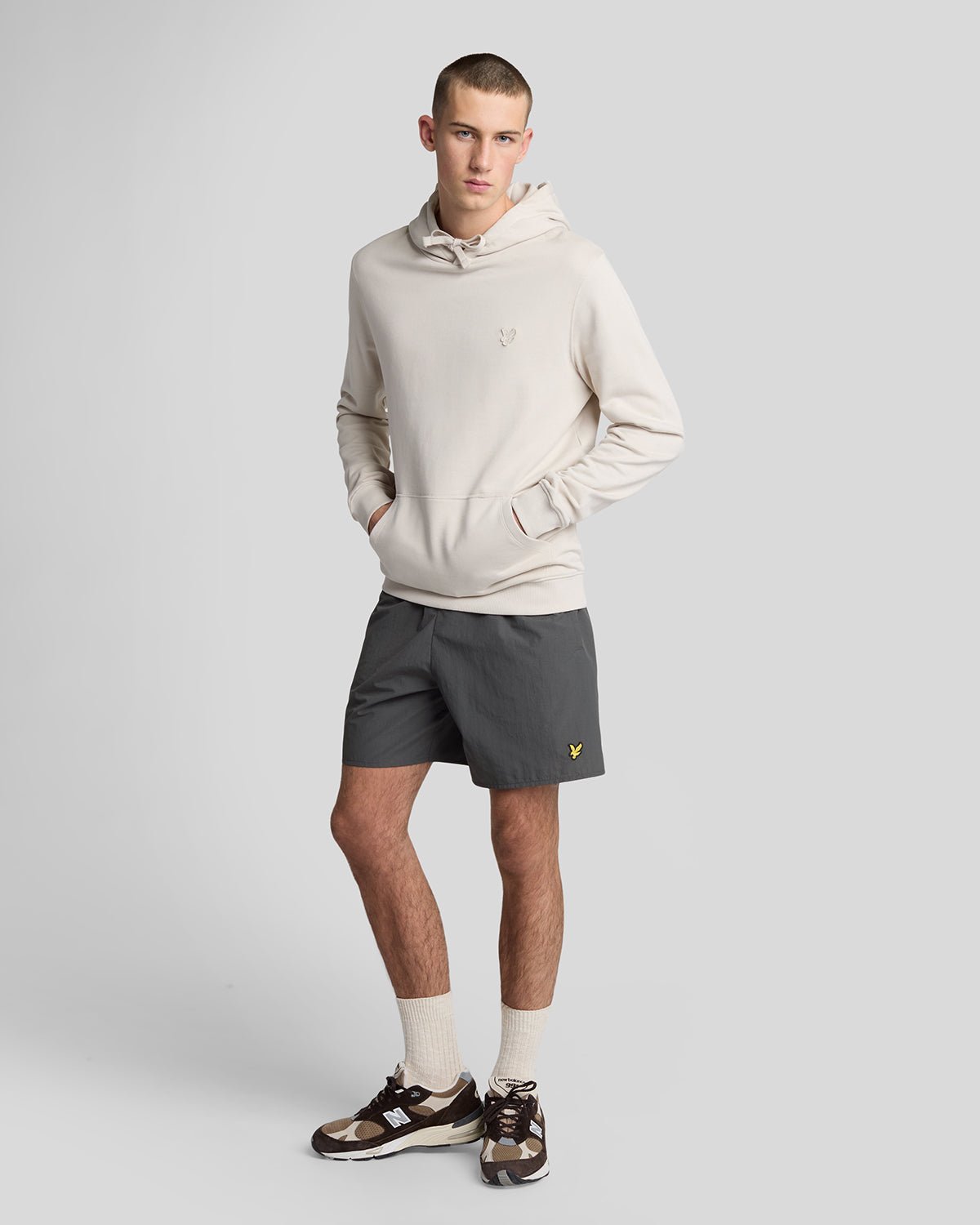 Man wears Plain Swim Shorts in Gunmetal