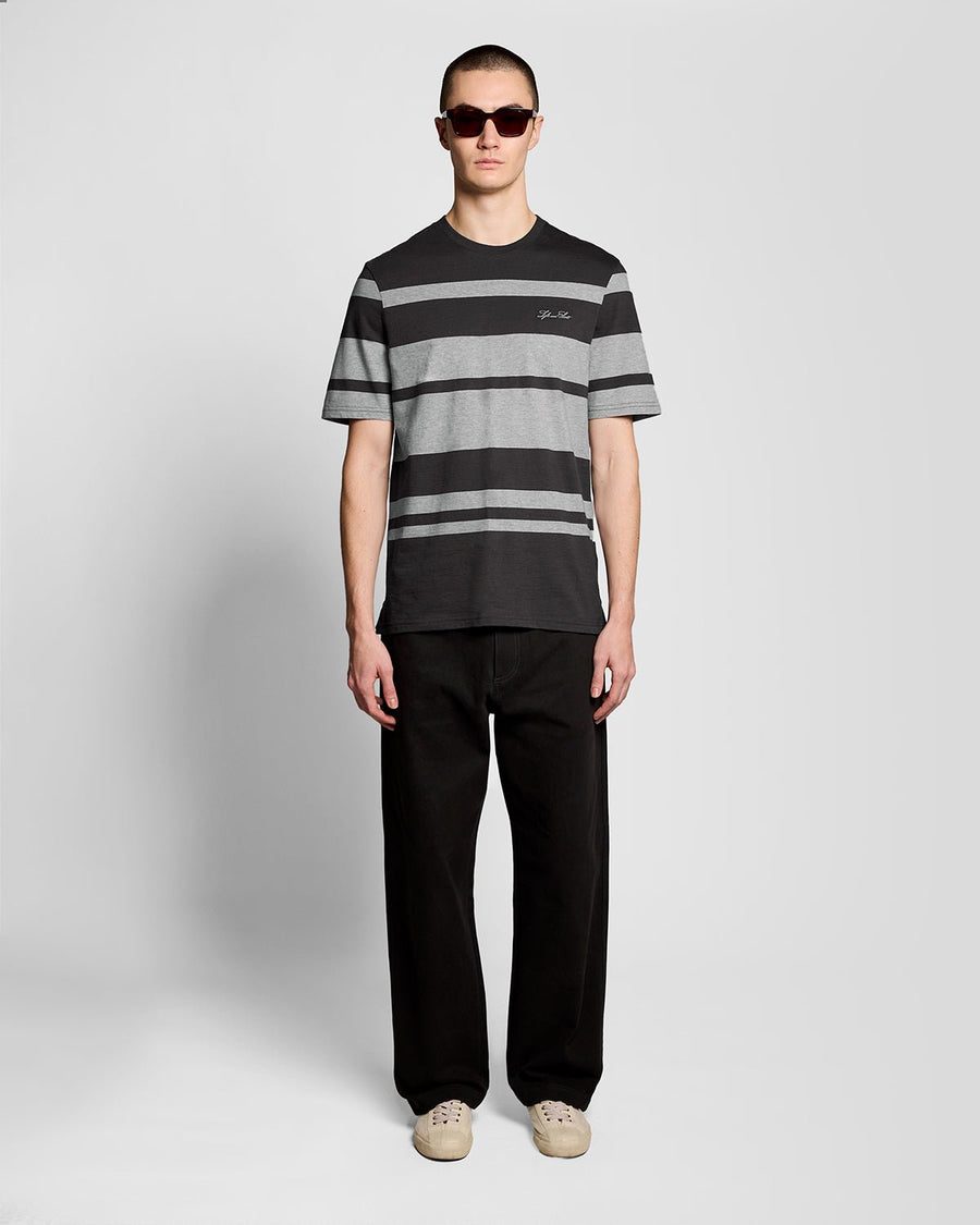 Man wears Relaxed Fit Stripe T-Shirt in Charcoal Grey/ Light Grey Marl