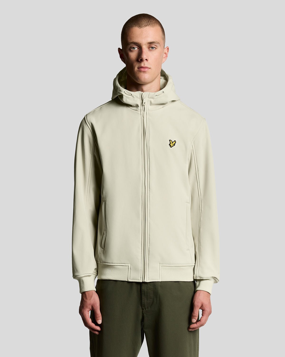 Man wears Fleece Lined Softshell Jacket in Grey Taupe
