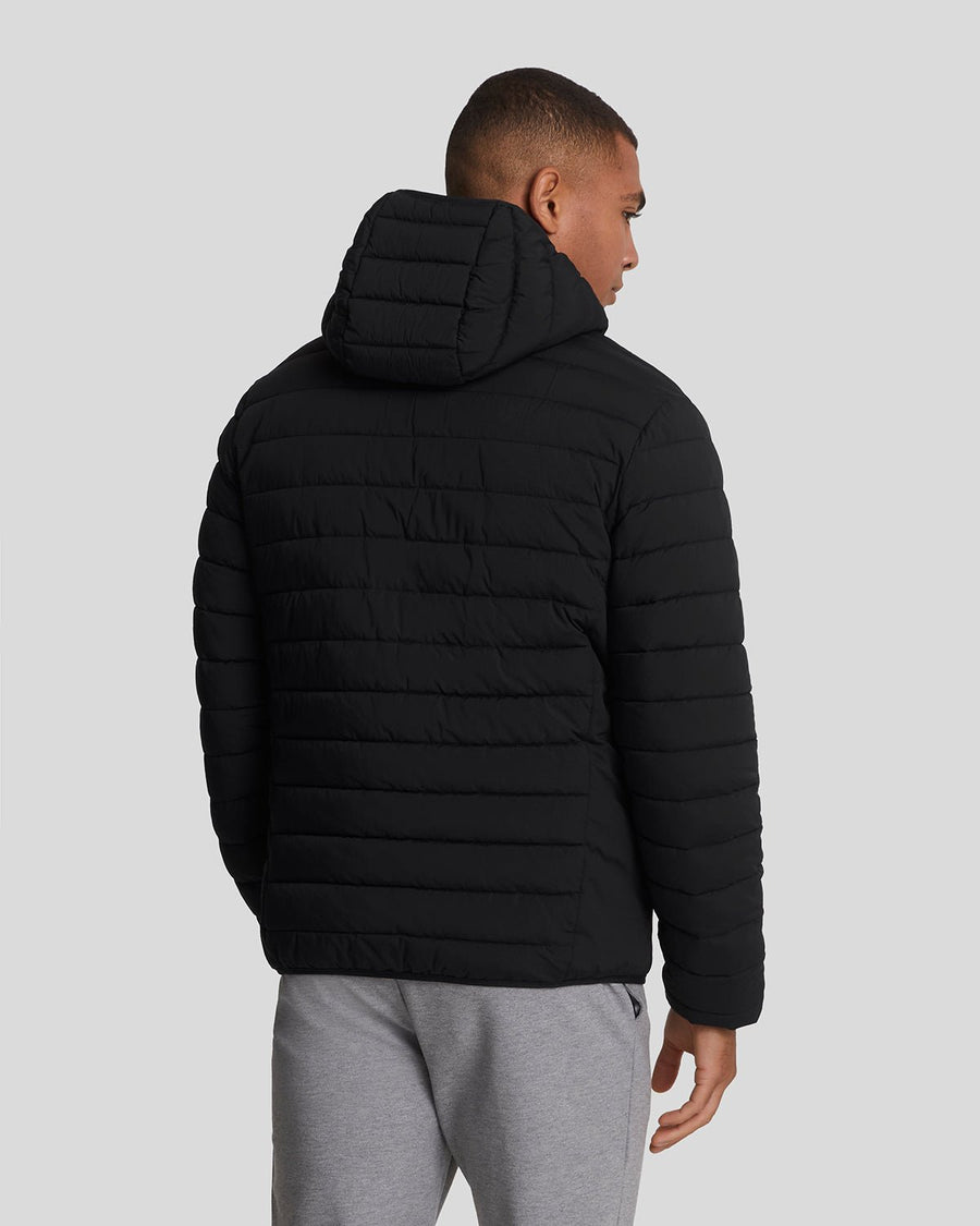 Man wears Sports Water Resistant Puffer Jacket in Jet Black