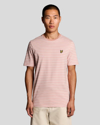 Man wears Pique Breton Stripe T-Shirt in Pink Grapefruit/ White