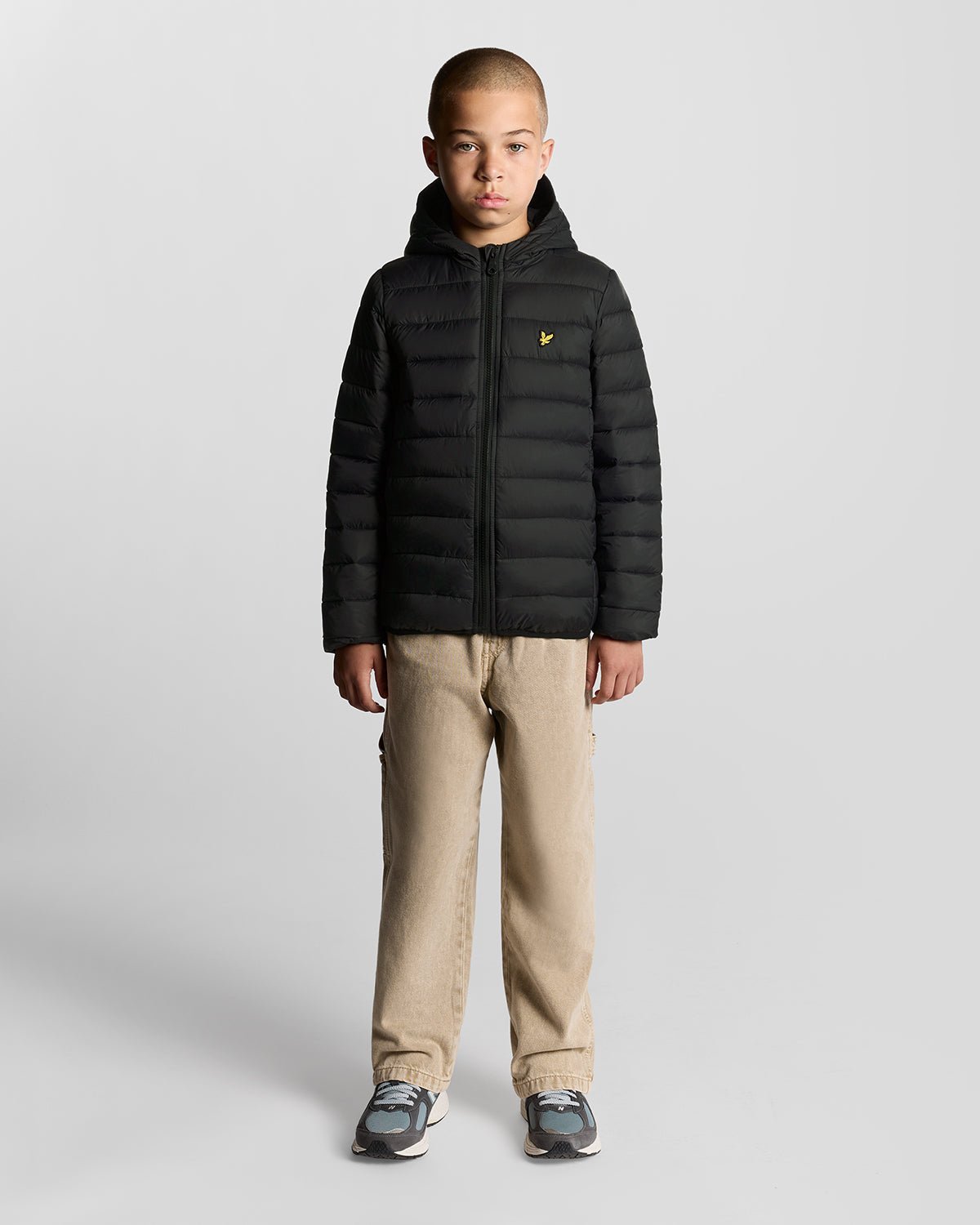 Boy wears Lightweight Padded Jacket in Jet Black