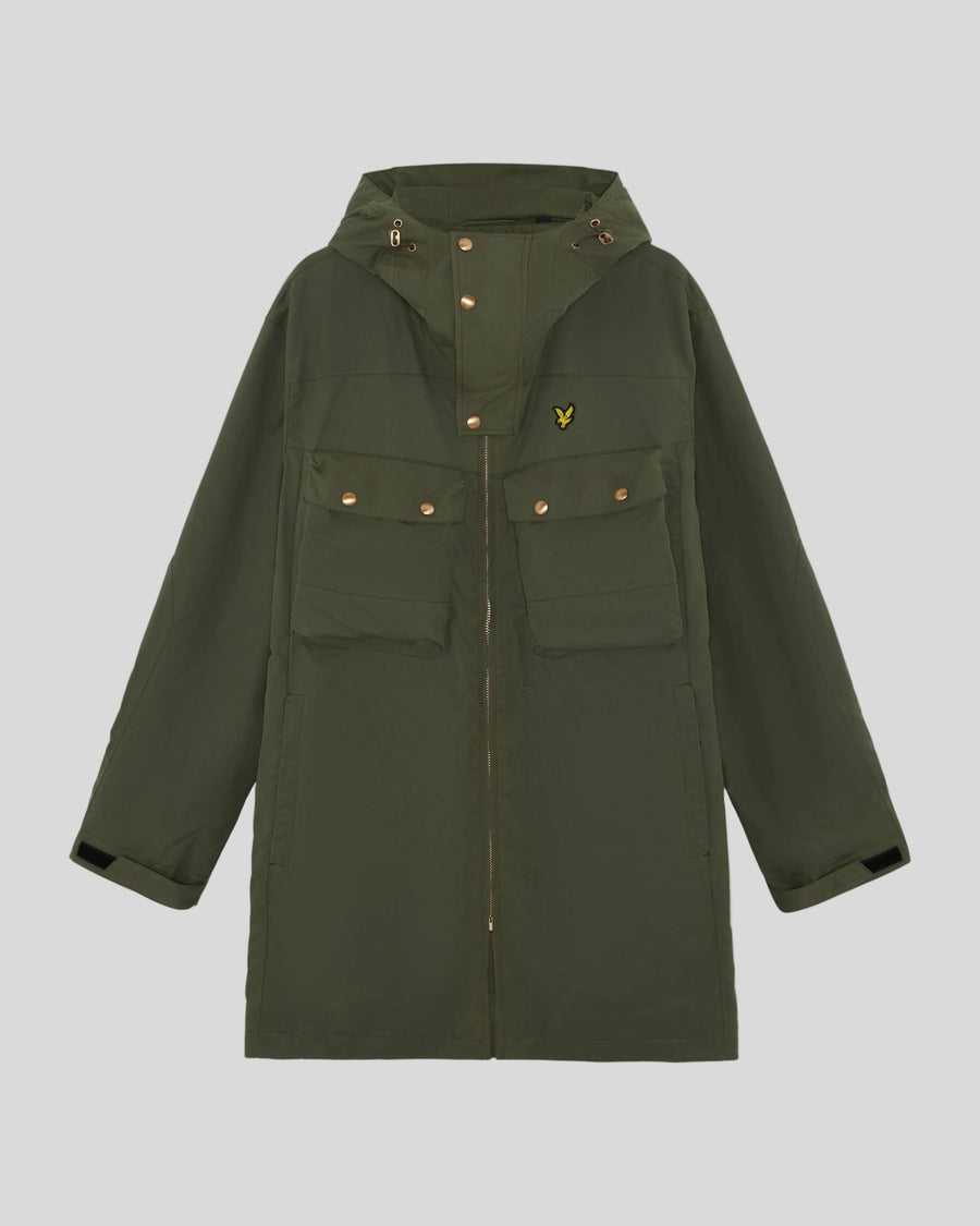 Man wears Waxed Guard Parka in True Olive