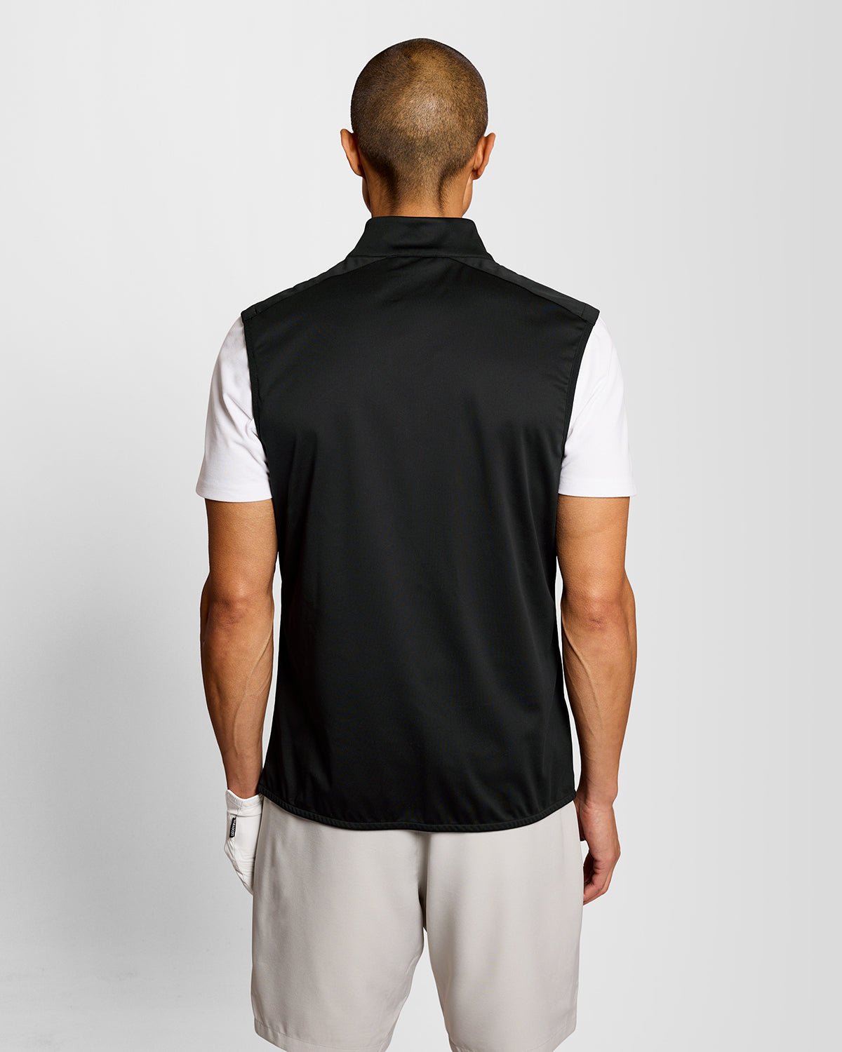 Man wears Windproof 1/2 Zip Gilet in Jet Black