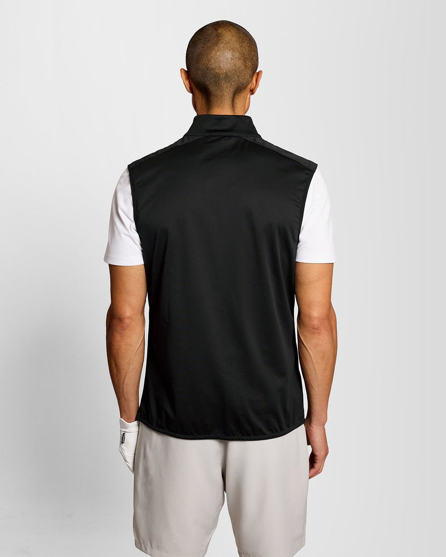 Man wears Windproof 1/2 Zip Gilet in Jet Black