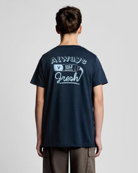 Man wears Back Print Graphic T-Shirt in Dark Navy