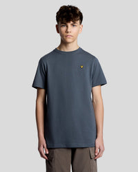 Man wears Sports Core T-Shirt in Turbulence